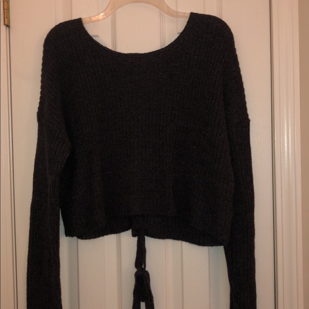 grey sweater with detailing on the back